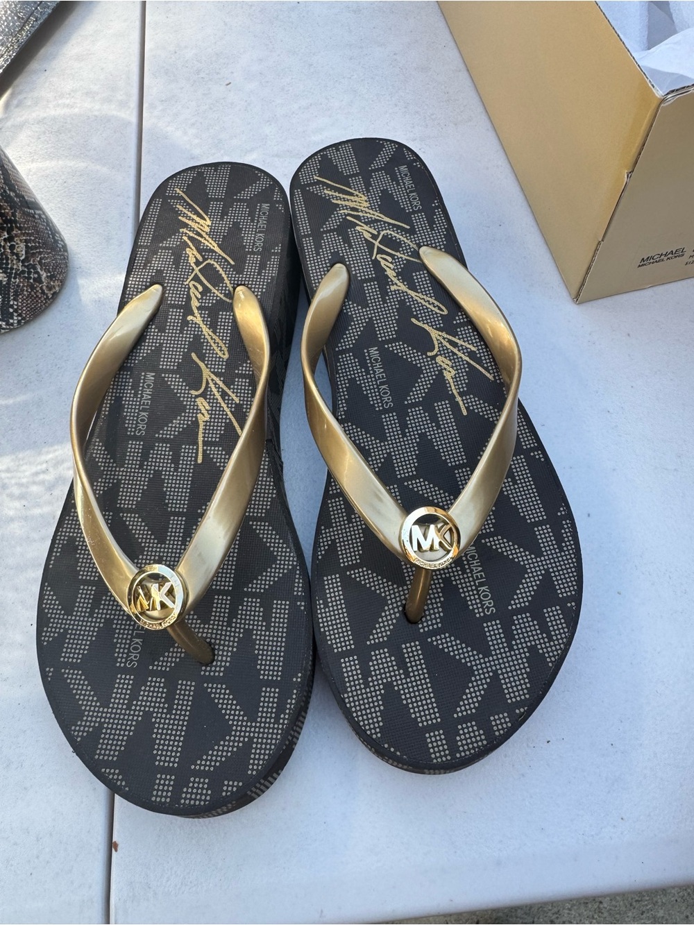 Michael Kors Gold-Strap Flip Flops with Black Monogram Footbed